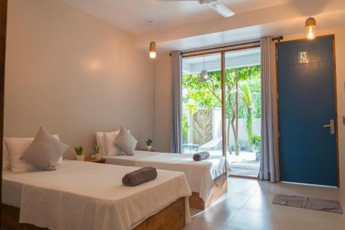 Rasdhoo Cama Y Desayuno | The Palm Ray Rasdhoo