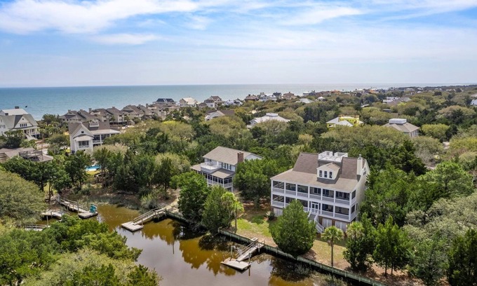 Debordieu Colony Casa | This vibrant family home features 8 bedrooms, and 8 bathrooms, ocean and creek views