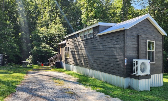 Mill Spring Casa | Tiny home on the creek, screened in porch, full kitchen, private firepit, sleeps 8
