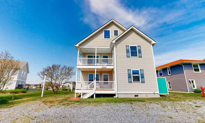 Cedar Neck Casa | Town of Ocean View canal-front home with dock, kayaks, balconies, grill, & AC
