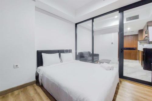 Pinang Apartamento | Tranquil and Comfort Living 1BR The Smith Alam Sutera Apartment By Travelio