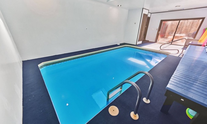 Canadensis Cabina | Tranquil Retreat: Rustic Cabin with Creek, Indoor Pool, and Theater Room