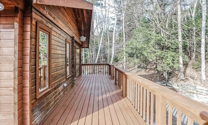 Raymond Casa | Tranquility, stone fireplace, lofted ceilings, wall of windows, & views