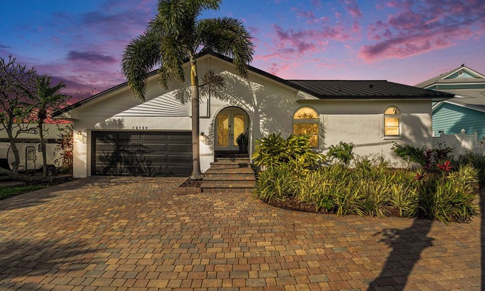 Capri Isle Casa | TREASURE ISLAND FLORIDA-- Discover your luxury 4 bedroom home on canal fishing