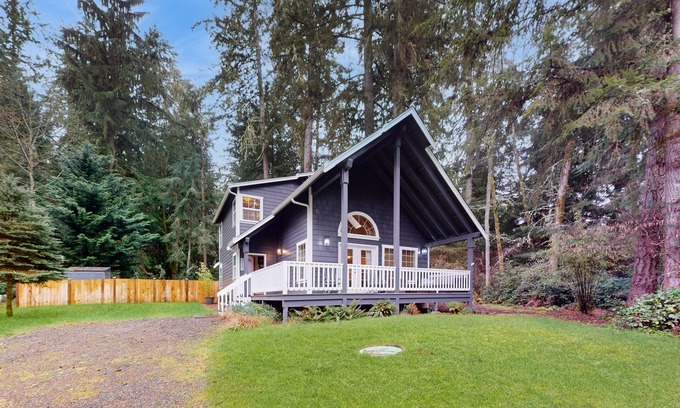Anderson Island Casa | Tree-lined Anderson Island home with porch & fenced yard, near dock/tennis