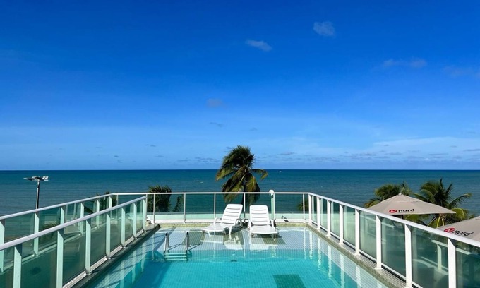 Cabo Branco Hotel | Triple suite with side sea view