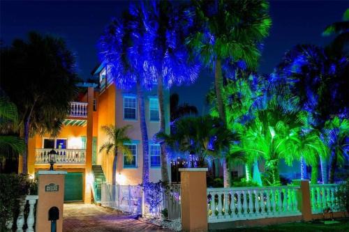 Holmes Beach Casa | Tropical luxury pool home by the beach with roof top lounge centrally located on Anna Maria Island