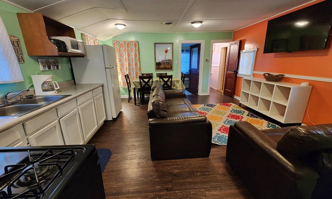 Monticello Cabina | Two Bedroom Cabin - Street & Pool View - Two bedroom cabin conveniently located at Outrigger Resort, right down the road from Indiana Beach Amusement Park! This 600 sq ft classic cabin offers two (2) queen beds and two (2) futons to sleep six (6)! Am