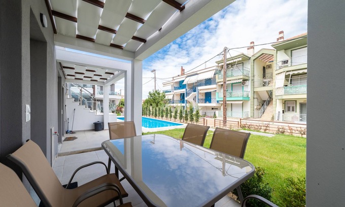 Paralia Ofryniou Villa | Two - Bedroom Loft with Pool Access, in Perla Residential Complex