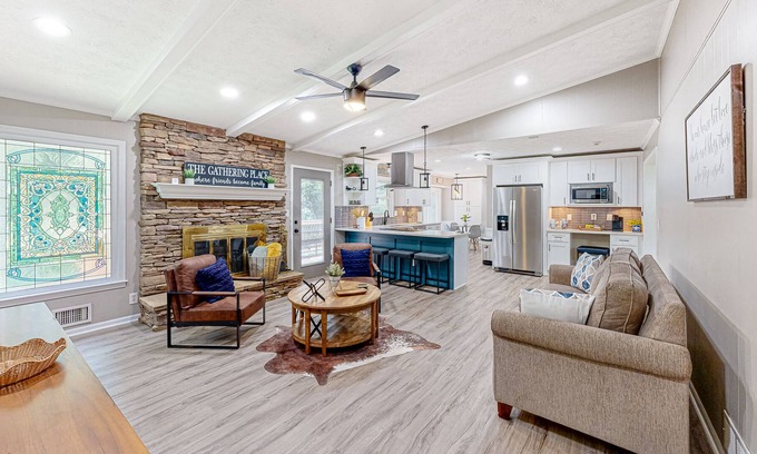 Lilburn Casa | Updated home with movie room, bar, entertainment space, Ping-Pong, & 2 kitchens