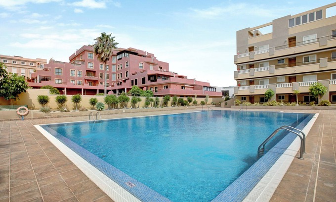 El Medano Apartamento | Apartamento de vacaciones 'La Perla D22 En El Médano' con piscina compartida, balcón y Wi-Fi