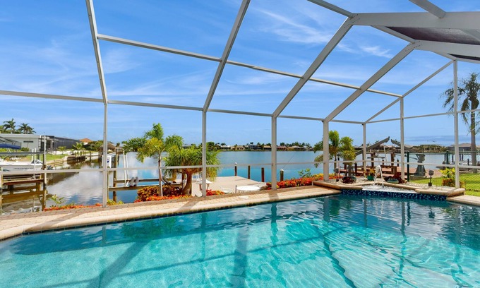 Eight Lakes Casa | Villa Aasta | Luxe Lakefront Outdoor Living | Screened Pool, Game Room & Dock