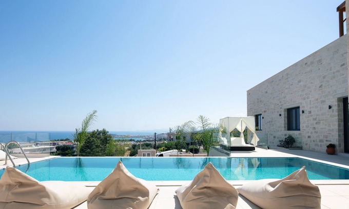 Violi Charaki Villa | Villa Sorin - stunning views, hot tub, 50m2 pool, walking distance to shops!