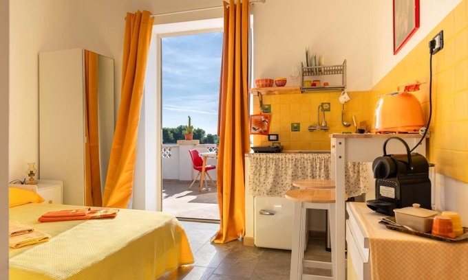 Monti D'arena-Bosco Caggione Apartamento | VillaSalentu.it, Lu Sule with a huge terrace overlooking the sea, sky, land.