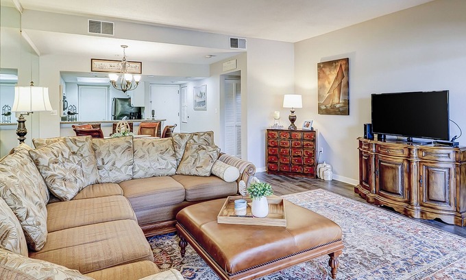 Shelter Cove Condominio | Waterfront condo with scenic balcony - pool, central AC, private washer/dryer