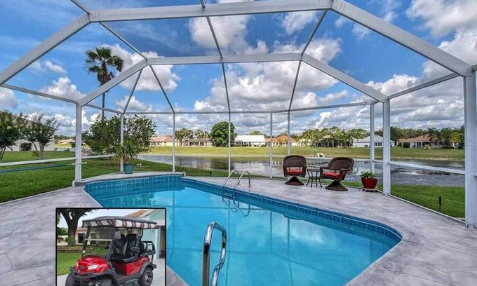 The Villages Casa | Premier home with Heated Pool, Waterfront, 2 king beds & 4 person golf cart.