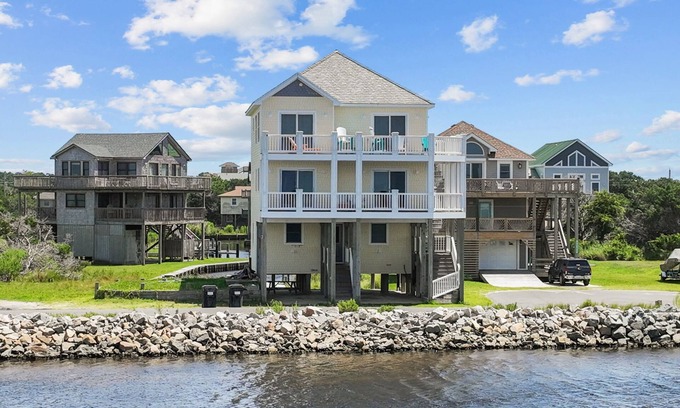 Frisco Casa | Waterfront home with boat dock, shared pool, & balcony with ocean view