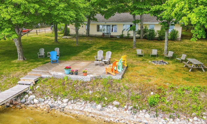 Central Lake Cabaña | Waterfront Torch Lake Cottage w/ Dock & Fire Pit!