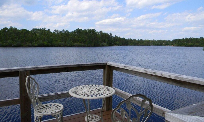 Boiling Spring Lakes Casa | Waterfront Lake with dock and lake access for your kayak at the park.