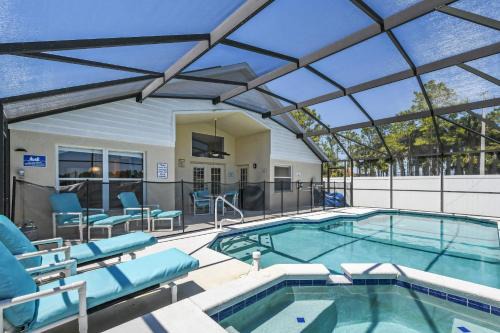 Windsor Palms Casa | Wheelchair accessible Lakeview 4BR house with pool spa themed rooms game room