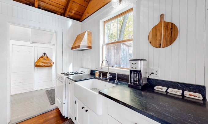 Camden Cabaña | Wooded home on the pond with WiFi, wood stove, full Kitchen, loft, bunks, & dock