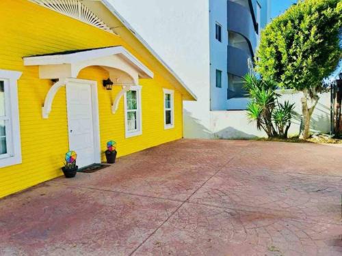 Villas de Rosarito Casa | Yellow Beachfront Dream Home