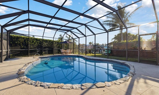 Venetian Way Casa | Your Ultimate Coastal Retreat! Stunning 4-Bed Canal-Front Home w/Pool & Lanai