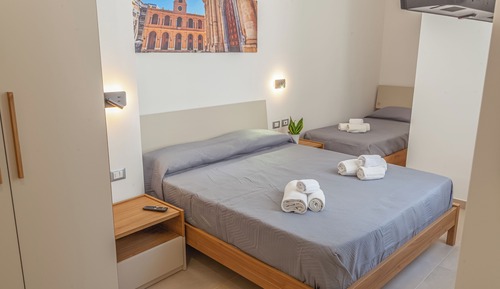 Habitación triple básica, varias camas