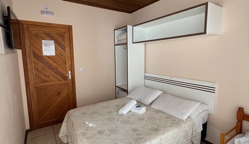 Quarto triplo com varanda