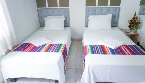 Habitación triple básica, varias camas