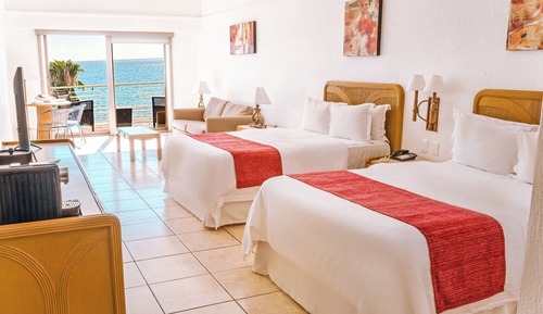 Habitación superior, varias camas, vistas al mar