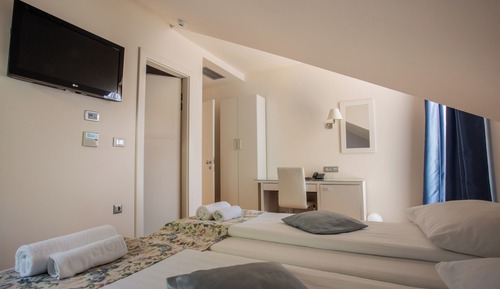 Habitación triple, vistas al mar