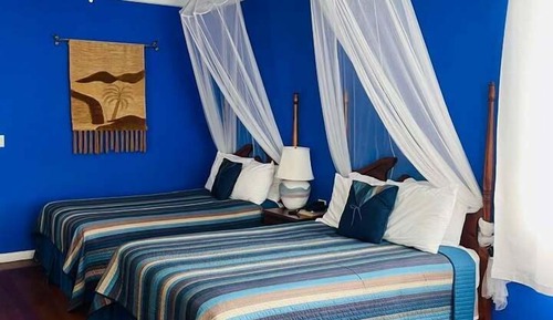 Habitación Deluxe, 2 camas dobles, balcón, vistas parciales al mar
