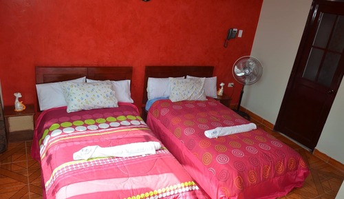 Habitación superior, varias camas