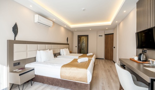 Habitación Confort con 2 camas individuales, varias camas