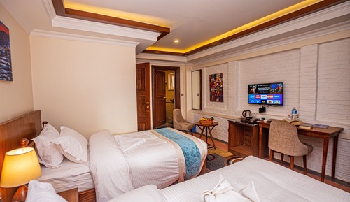 Habitación Deluxe con 2 camas individuales, 1 cama individual grande