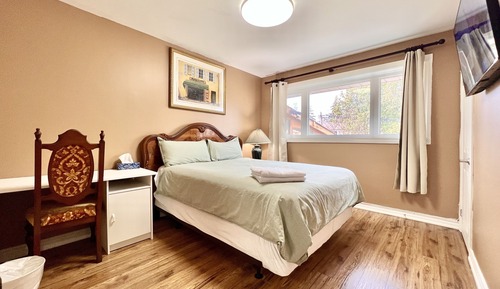 Habitación Confort doble, 1 cama de matrimonio, baño compartido, vistas al jardín
