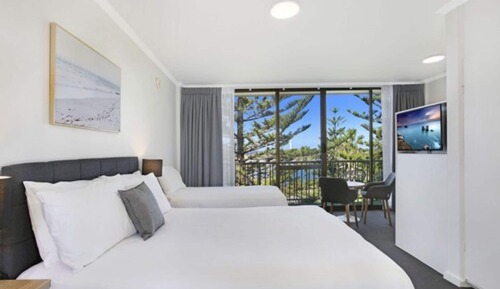 Habitación triple, vistas al mar
