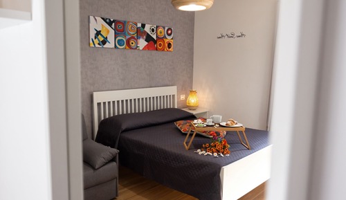 Habitación cuádruple Deluxe, 1 cama de matrimonio grande con sofá cama