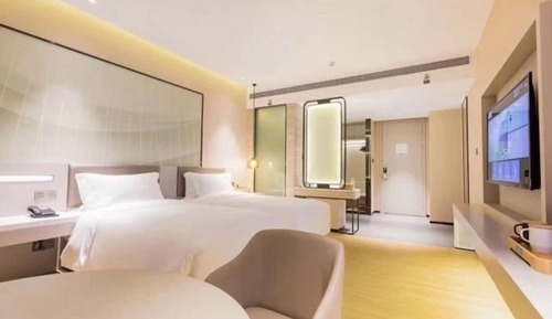 Habitación Business con 2 camas individuales, varias camas