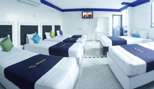 Habitación cuádruple superior, varias camas