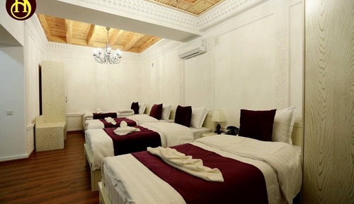 Habitación cuádruple Deluxe, varias camas