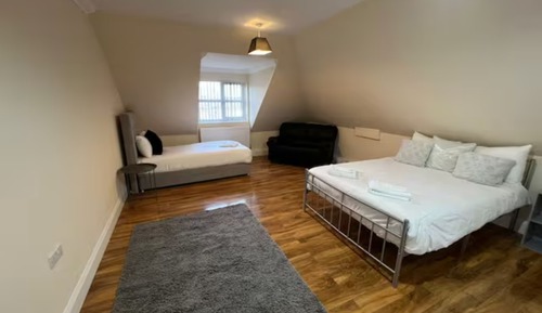 Habitación triple, varias camas
