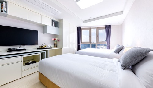 Habitación familiar con 2 camas individuales, vistas a la ciudad