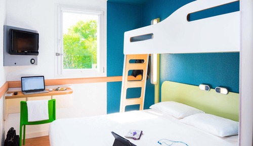 Habitación triple, varias camas