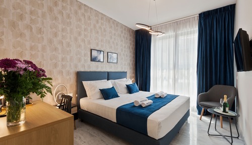 Habitación Deluxe, bañera de hidromasaje, vistas a la ciudad