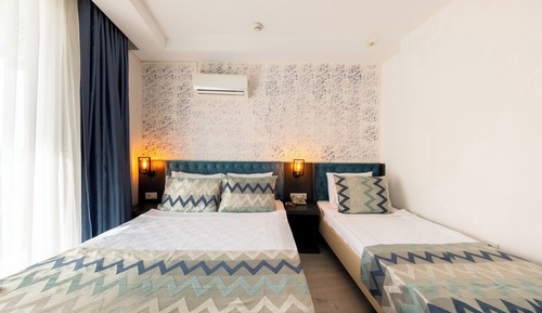 Habitación triple estándar, varias camas