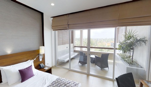 Habitación superior con 2 camas individuales, vistas a la ciudad