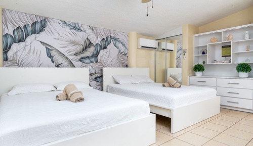Habitación Signature, 2 camas de matrimonio, acceso a la piscina, vistas al jardín (Solario)