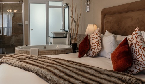 Habitación junior con 2 camas individuales, 2 camas individuales, bañera, vistas al mar